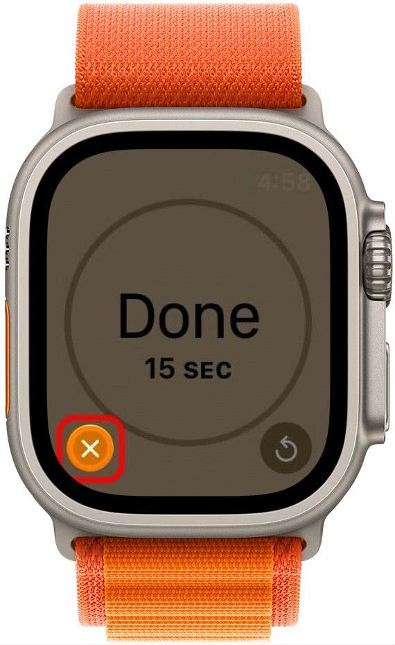 apple watch timer done screen with dimmed background, the stop button highlighted and a red box around it