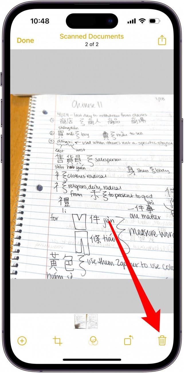 a lined notebook page with w red arrow pointing the garbage can icon in the bottom right corner.