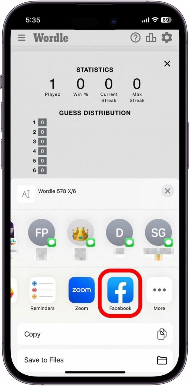 how to share wordl on facebook and whatsapp tap facebook icon