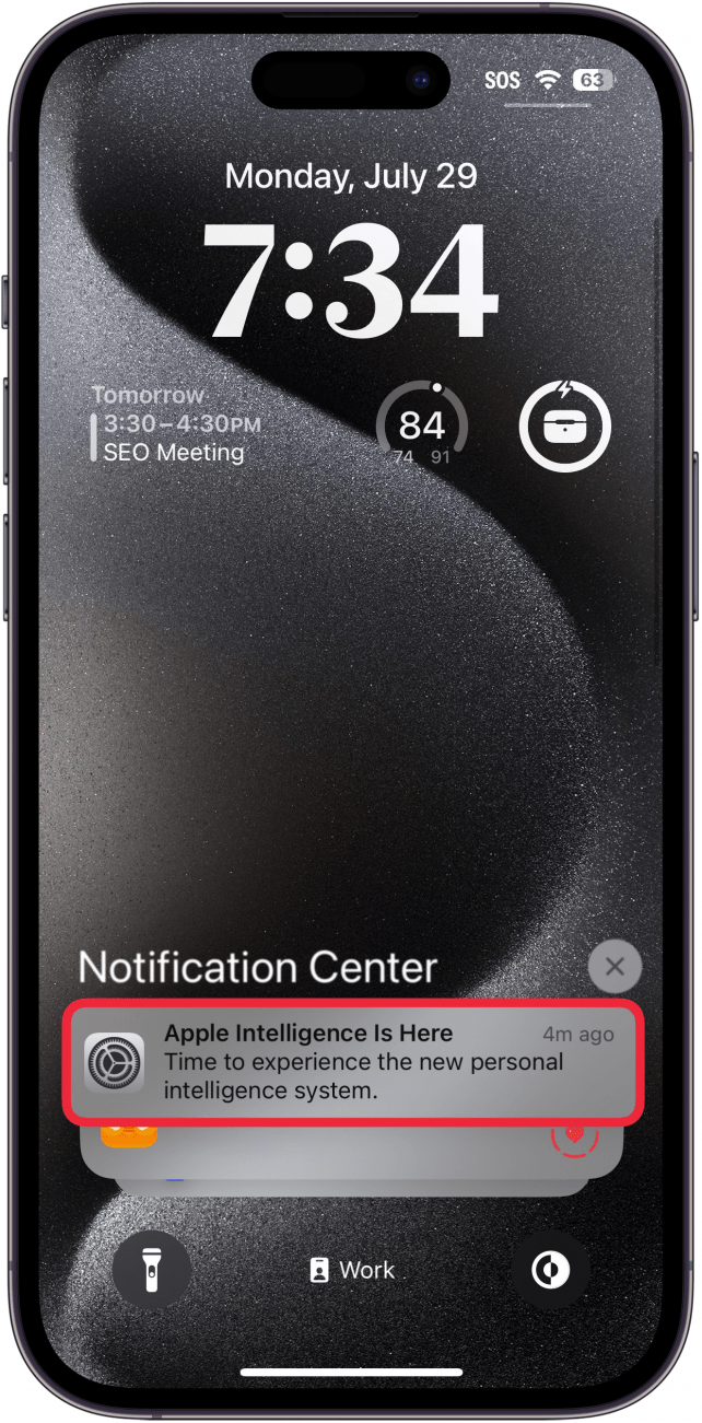 iphone lock screen displaying a notification that apple intelligence is ready to be used with this iphone, and a red box around the notification