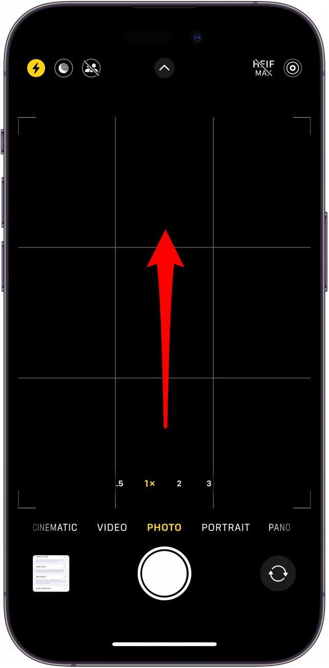iphone camera app with red arrow in center of screen indicating to swipe up