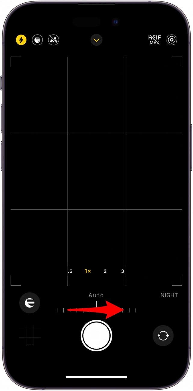 iphone camera app with night mode slider, and a red arrow pointing right, indicating to swipe right
