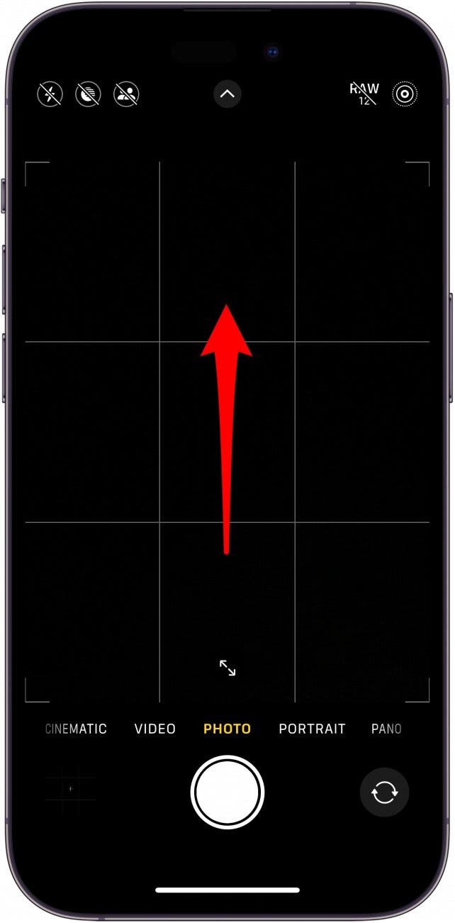 iphone camera app with a red arrow point upwards from the middle of the screen, indicating to swipe up