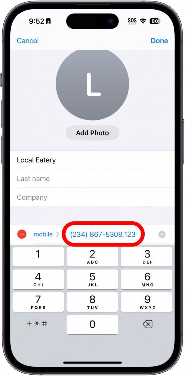 iphone edit contact phone number screen displaying a keypad and a red box around the new phone number with an extension added on to the end