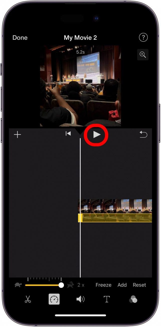 iphone imovie app timeline screen with play button circled in red