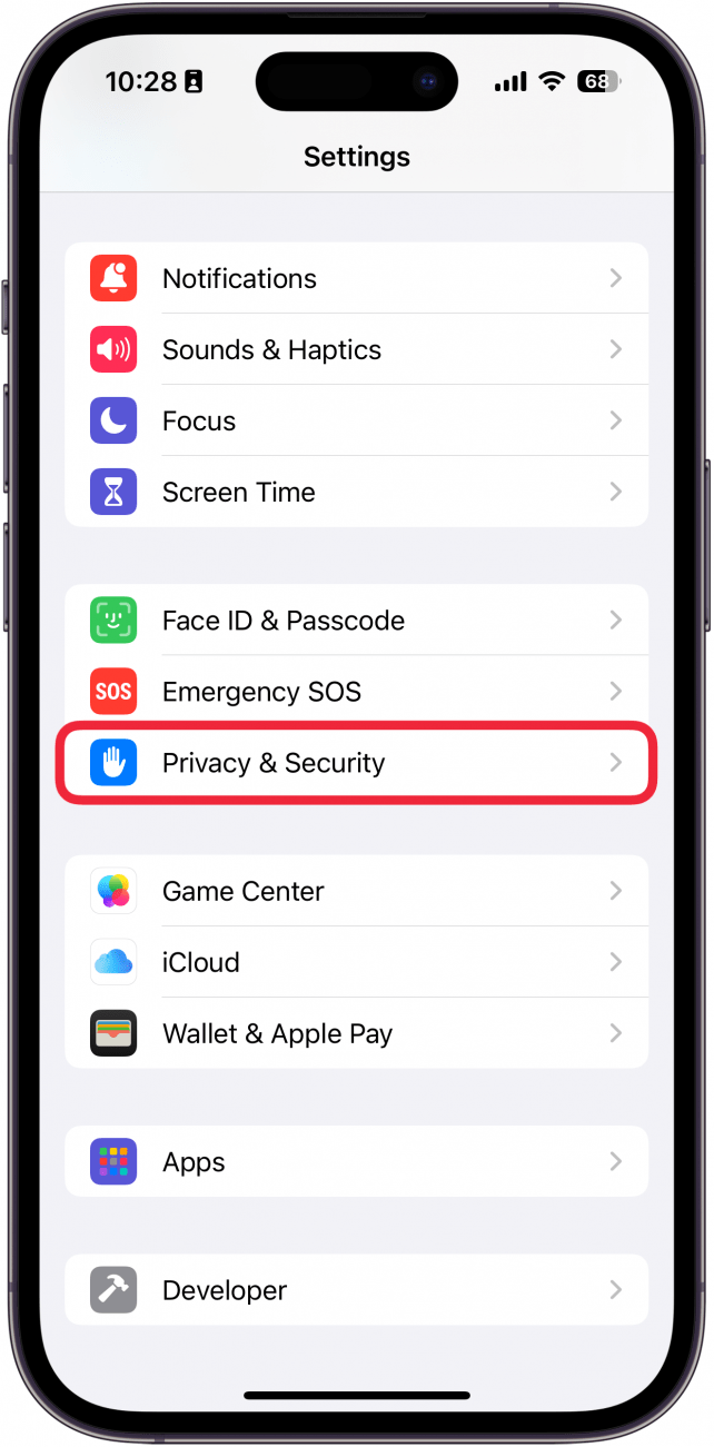 iphone settings app with a red box around privacy and security