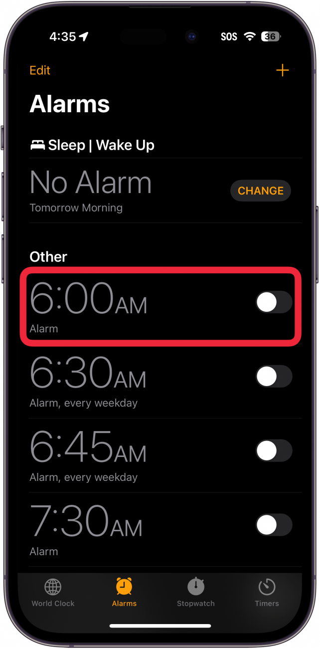 iphone clock app with a red box around an alarm simply labeled alarm