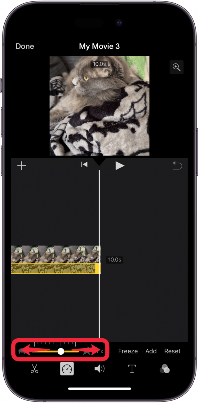 iphone imovie app editing screen with a red box around speed slider with arrows pointing left and right, indicating that the user can drag the slider left or right