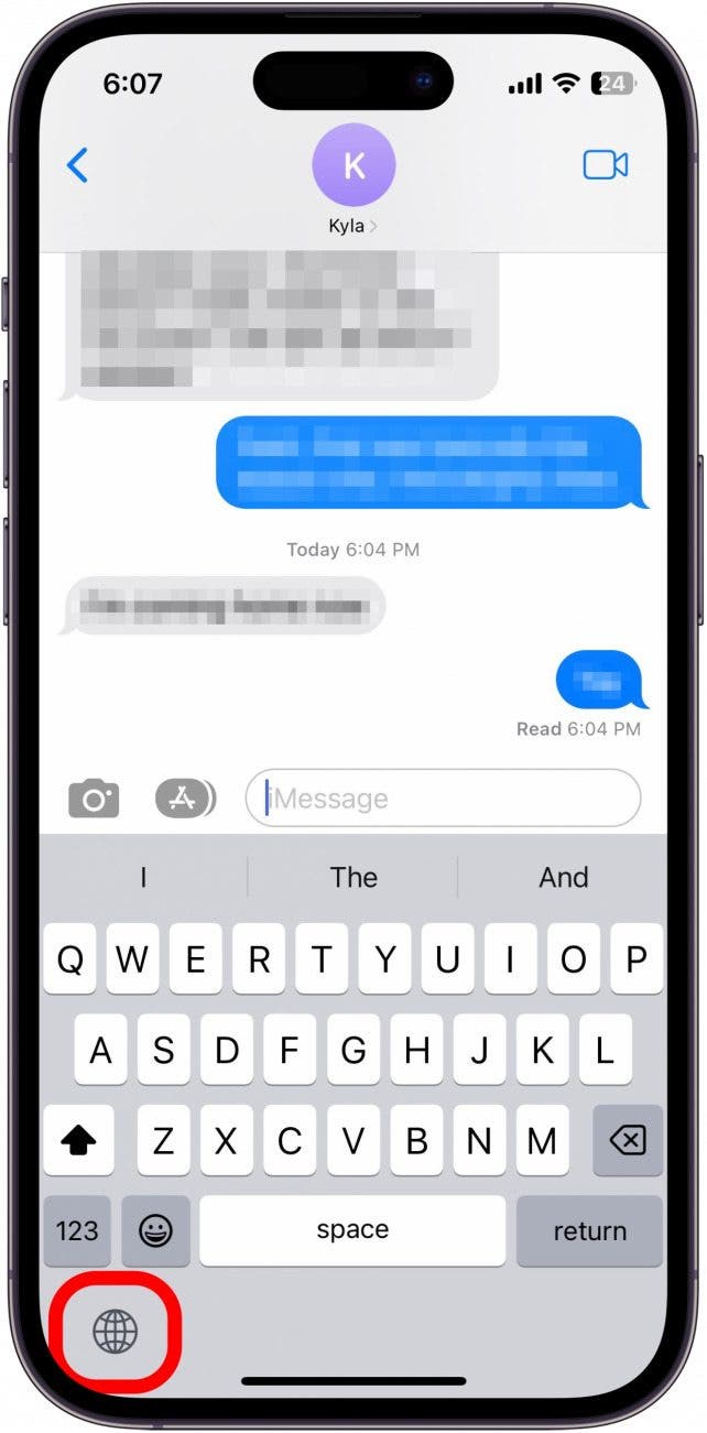 In any text field, press and hold the Switch Keyboard button.