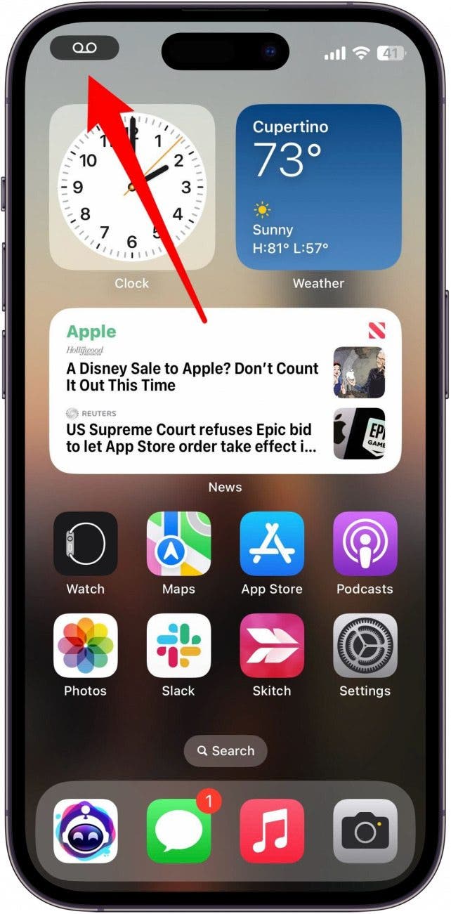 iphone home screen with red arrow pointing to voicemail icon in the upper left corner