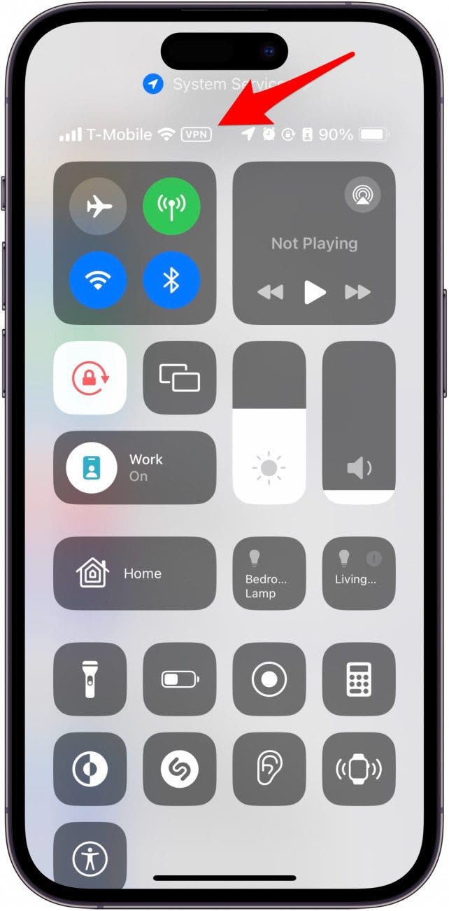 iphone control center with a red arrow pointing to the VPN icon in the status bar, next to the cellular/wifi connection icons