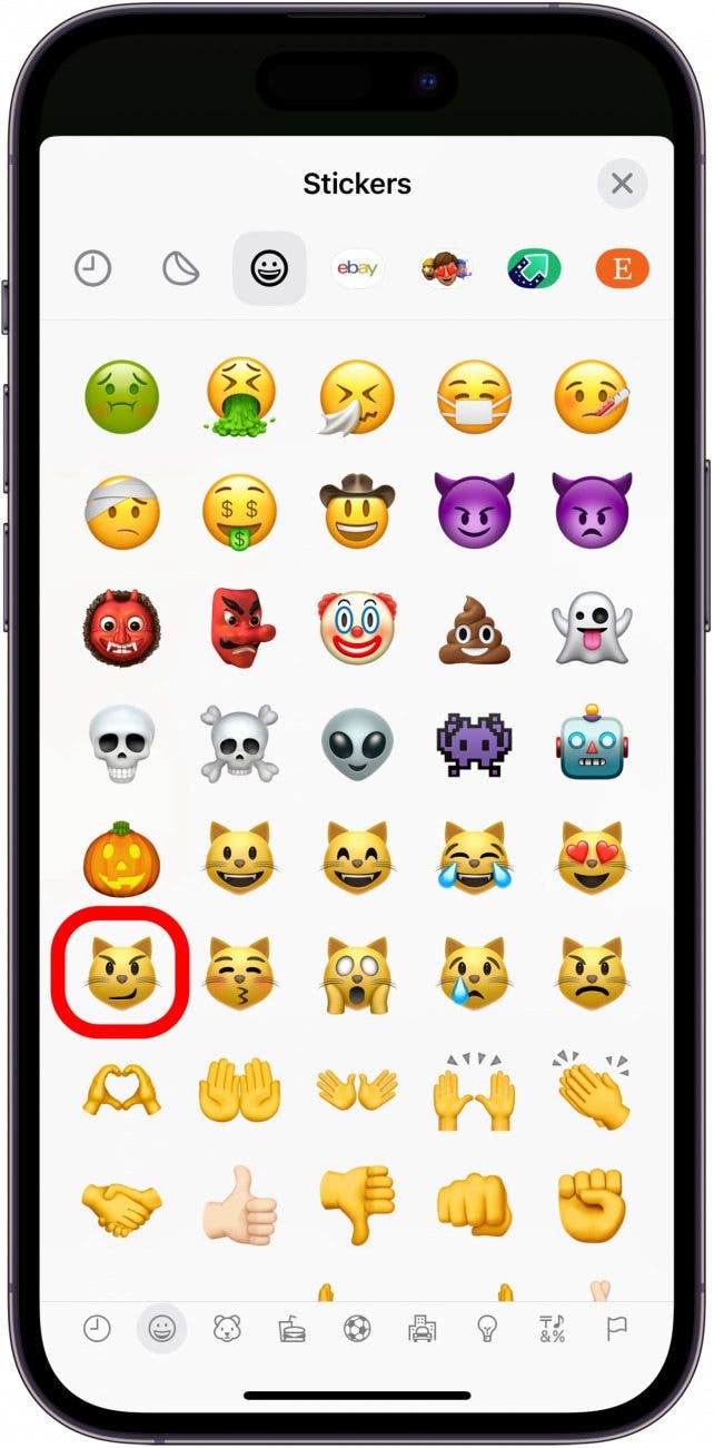 iphone photo markup showing list of emoji stickers with cat emoji circled in red