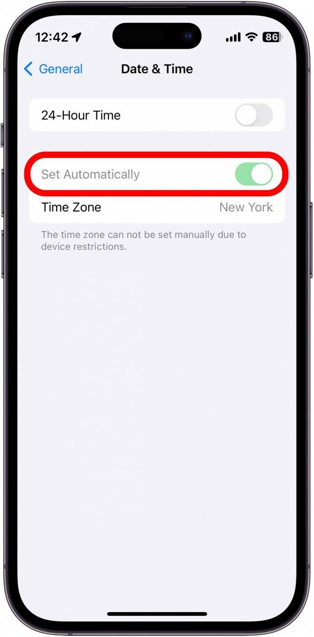 iphone date and time settings showing the set automatically toggle as grayed out, indicating that the setting cannot be changed