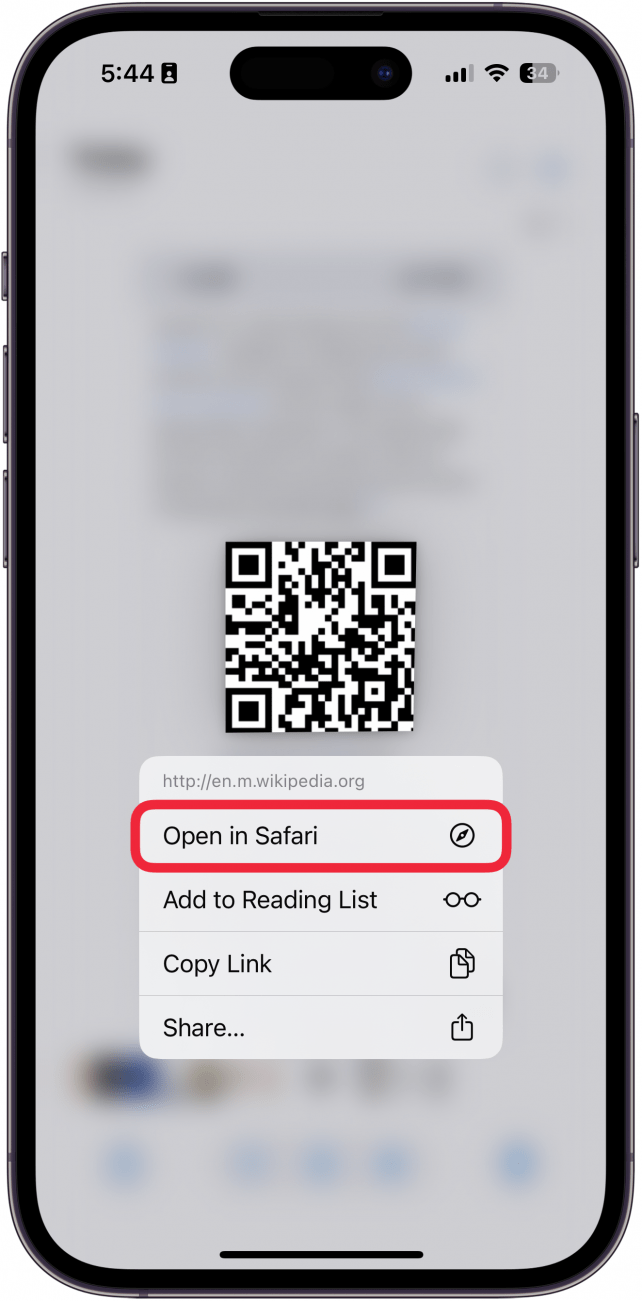 iphone photos app viewing a screenshot of a QR code displaying a context menu after tapping the holding the code, with a red box around open in safari