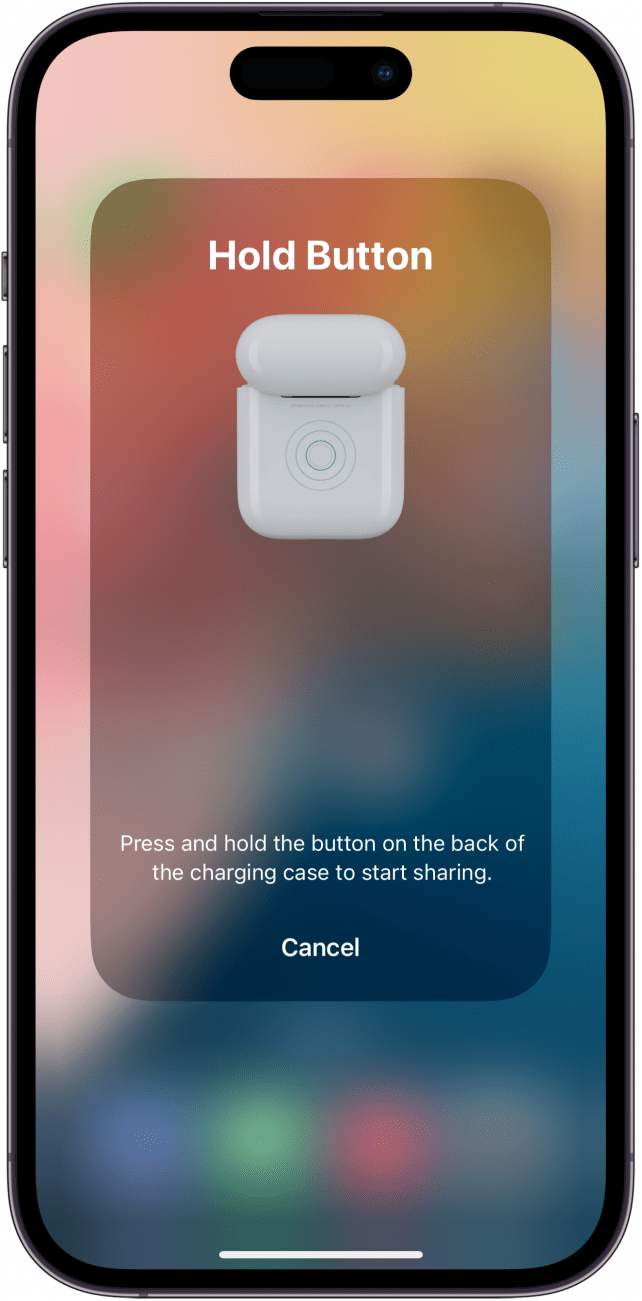 iphone share audio menu set up instructing the user to press the button on the back of the airpods case