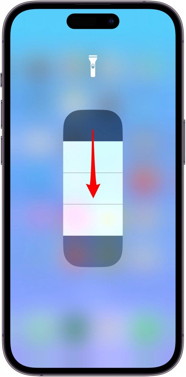 Swipe down on the bar to dim the flashlight. 