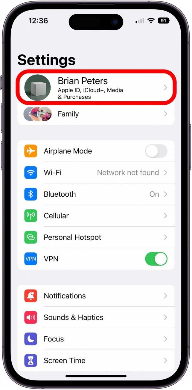 Settings app main screen with Apple ID option marked.