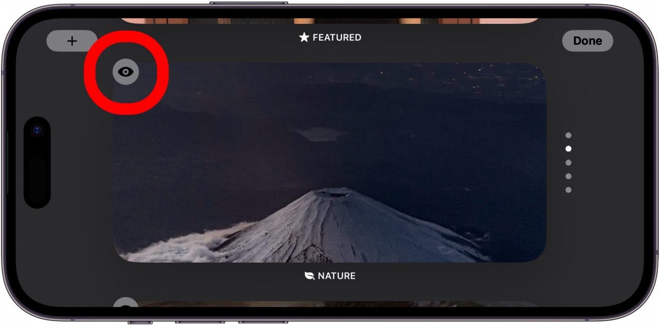 iphone standby photos screen with eye icon circled in red