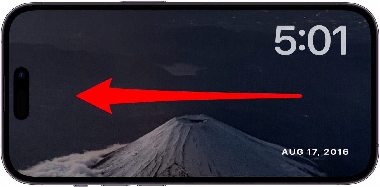 iphone standby photos screen with red arrow pointing left across the screen, indicating to swipe left on the screen