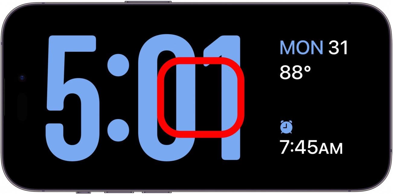 iphone standby clock screen with red box in the center of the screen, indicating to tap and hold on the screen