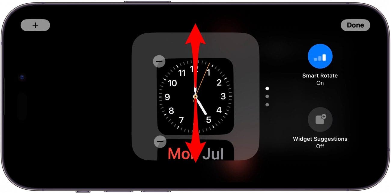 iphone standby widgets screen with red arrows pointing up and down on widget stack, indicating to swipe up or down