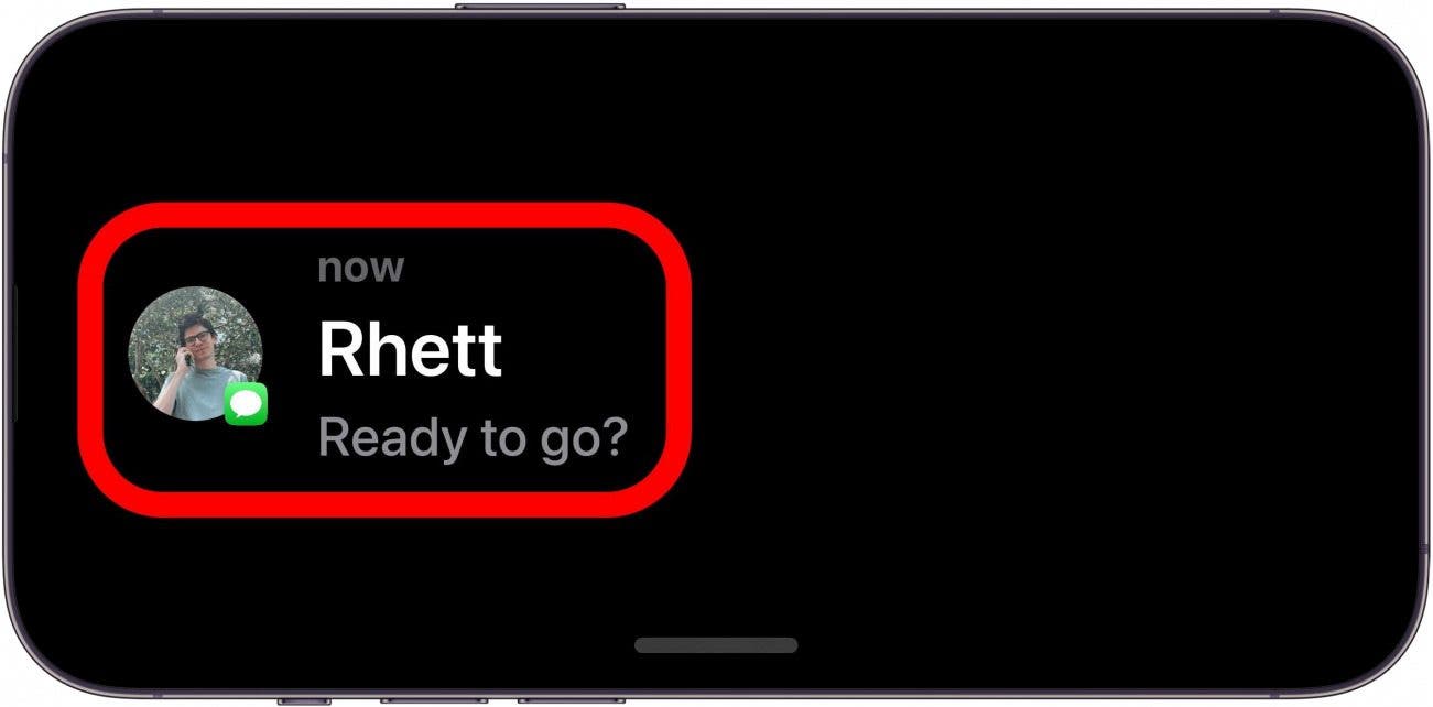 iphone standby mode displaying a text notification from rhett reading, "ready to go?"