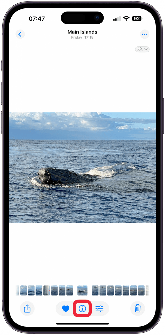 Open the photo you want to edit, then tap the info icon.