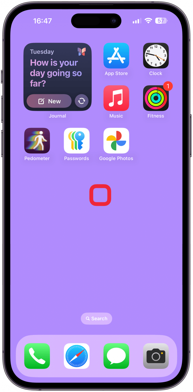 Long-press a blank space on your Home Screen until your apps start to jiggle.