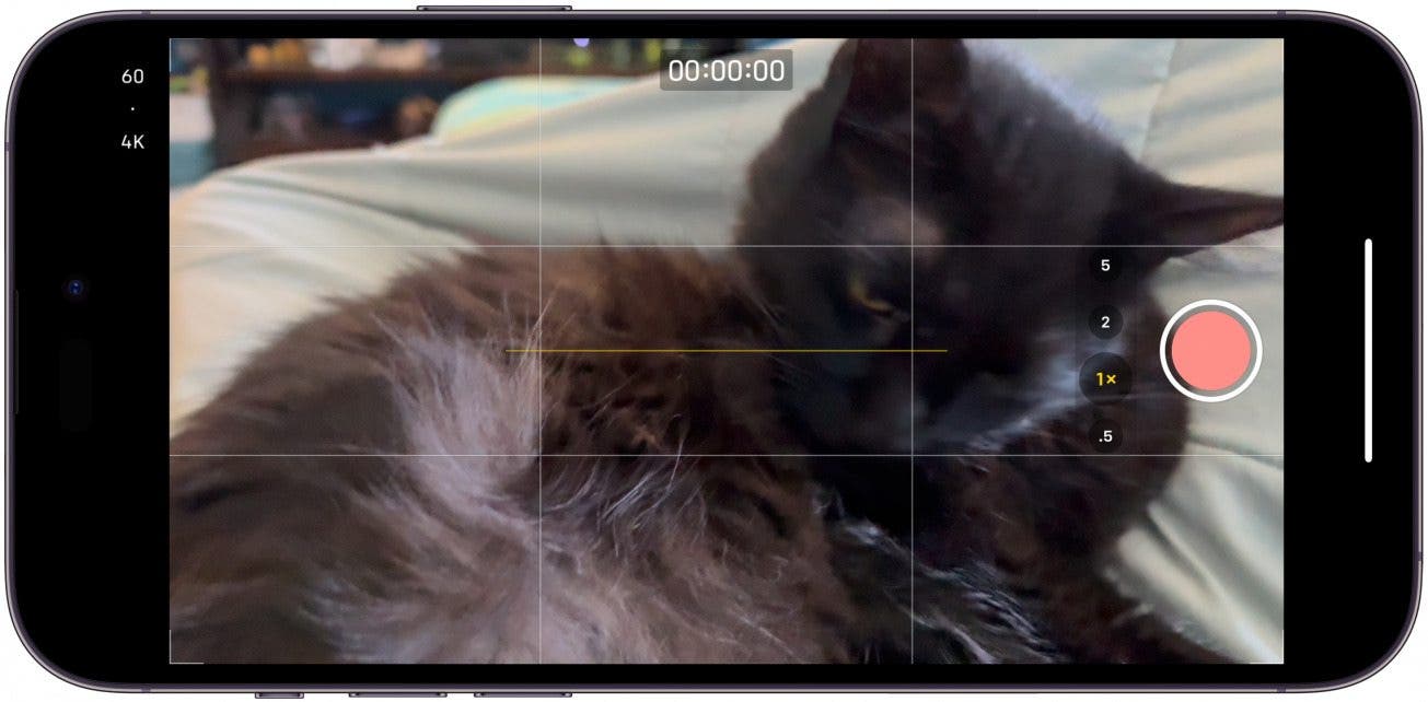 If you hold in the Camera Control button once the Camera app is open and in the default photo mode, it will start recording a video for as long as you keep holding in the button.