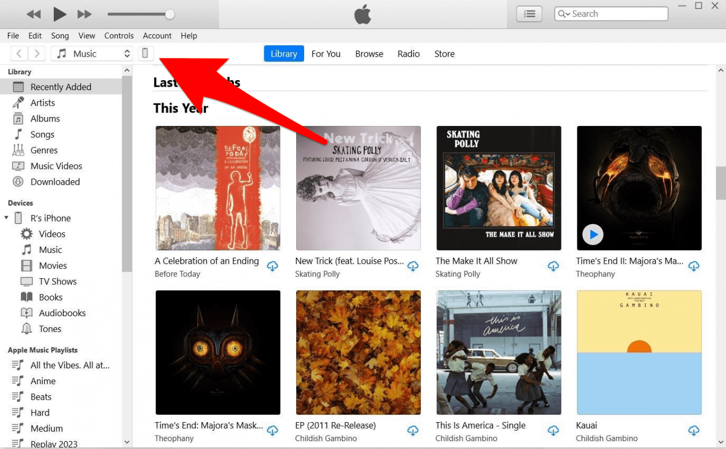 itunes pc app with a red arrow pointing at the device button