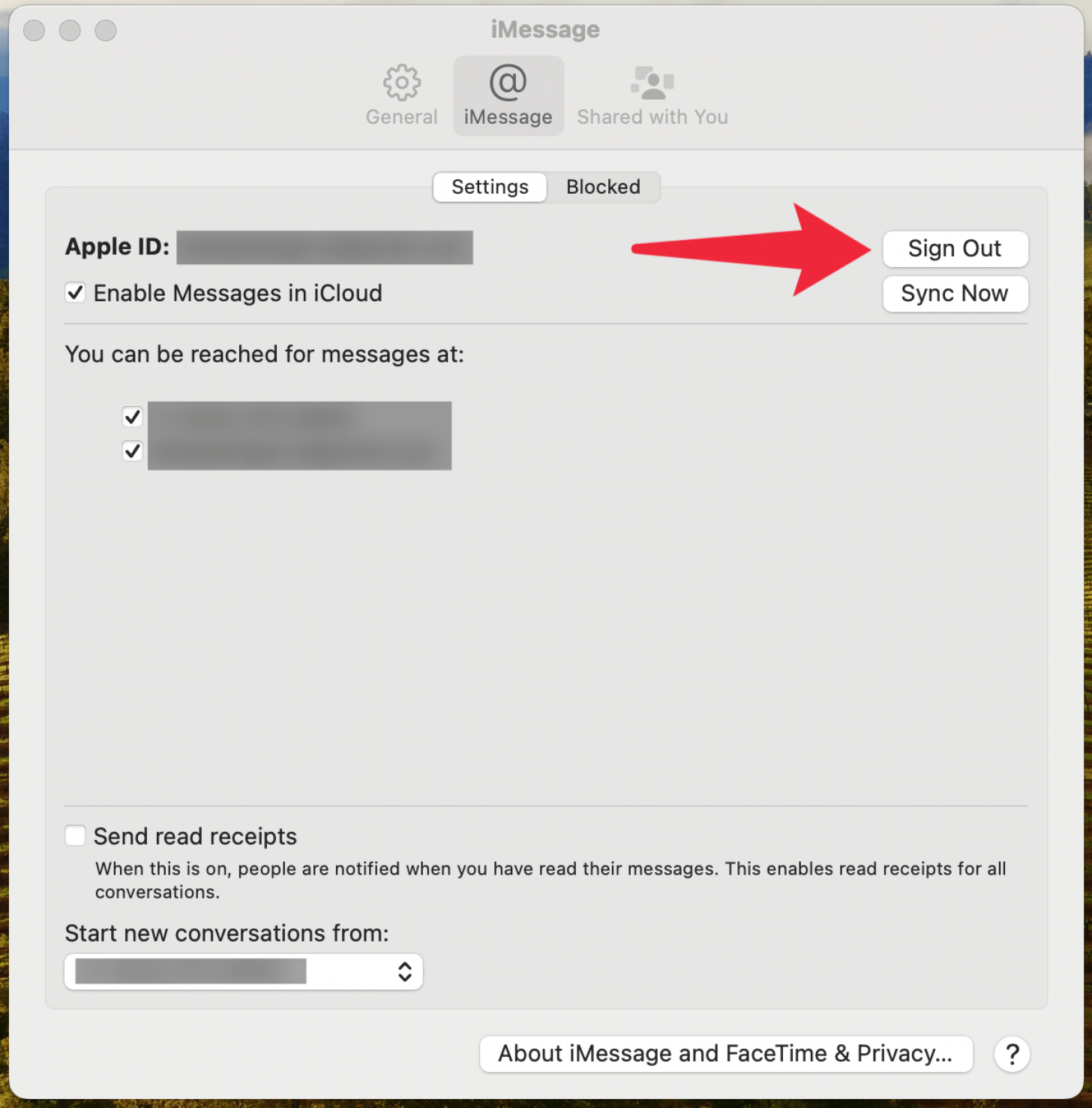 mac imessage settings with a red arrow pointing at sign out button