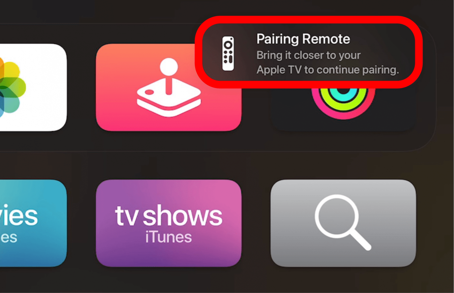 Place your as close to the Apple TV as possible and wait until it disappears.