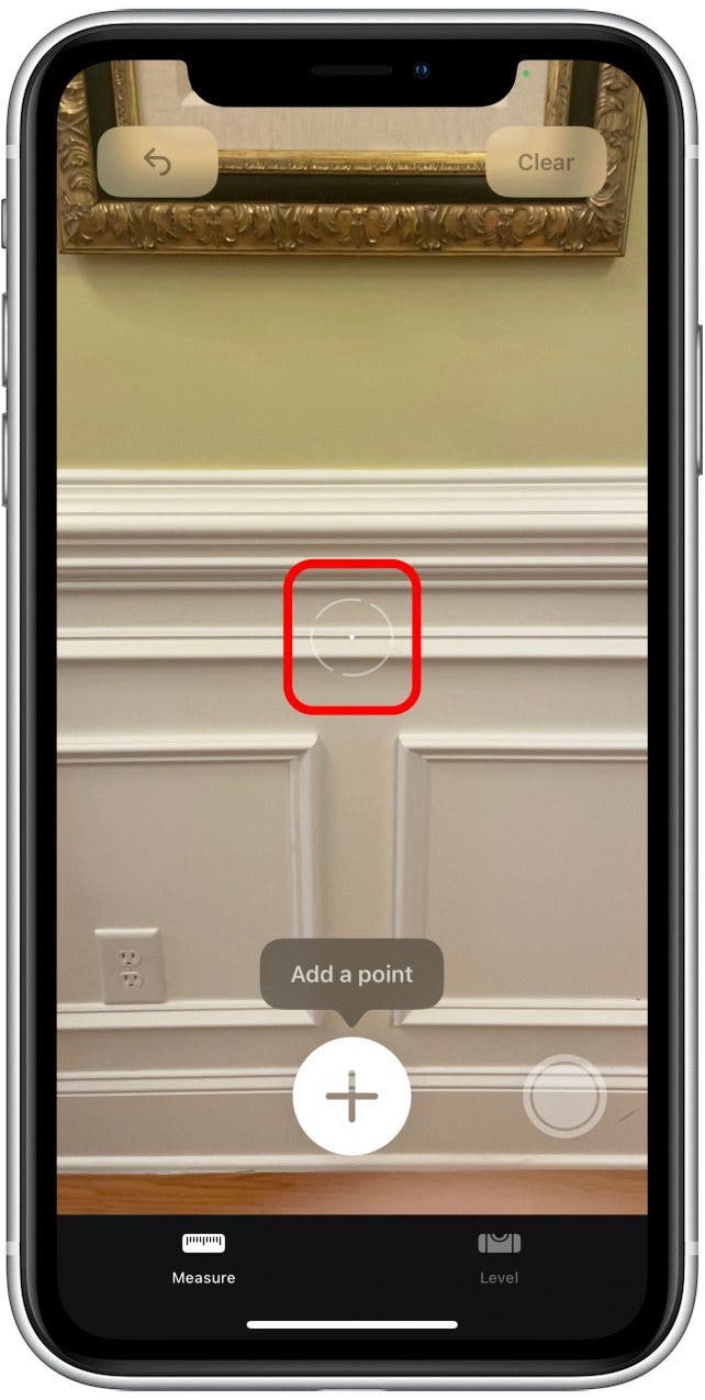 When your phone is ready to start measuring, you'll see a white dot in a circle appear.