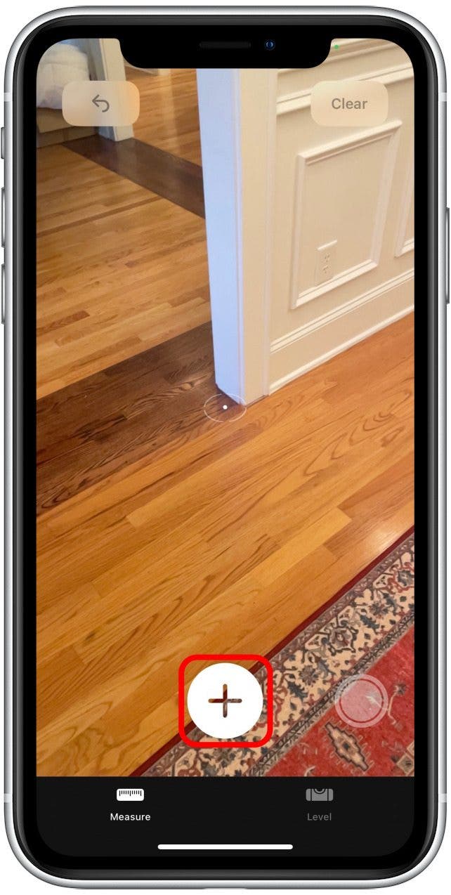 Position the white dot over the place you'd like to start your measurement, tap the plus sign. 