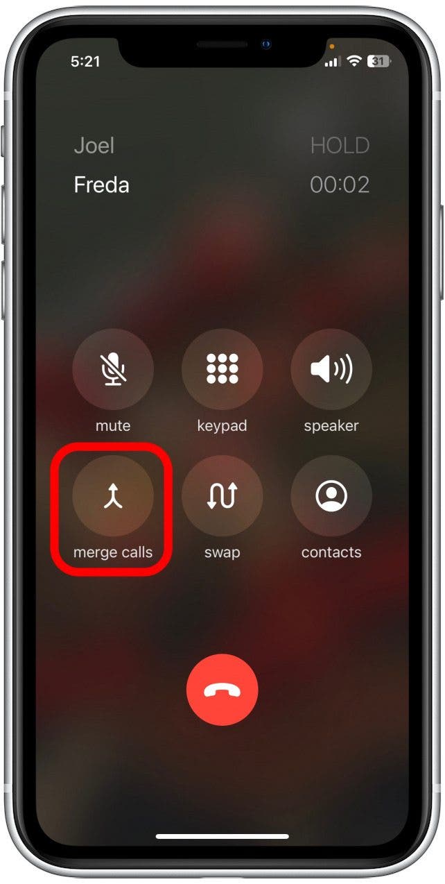 Tap Merge Calls to create a three-way call on your iPhone.