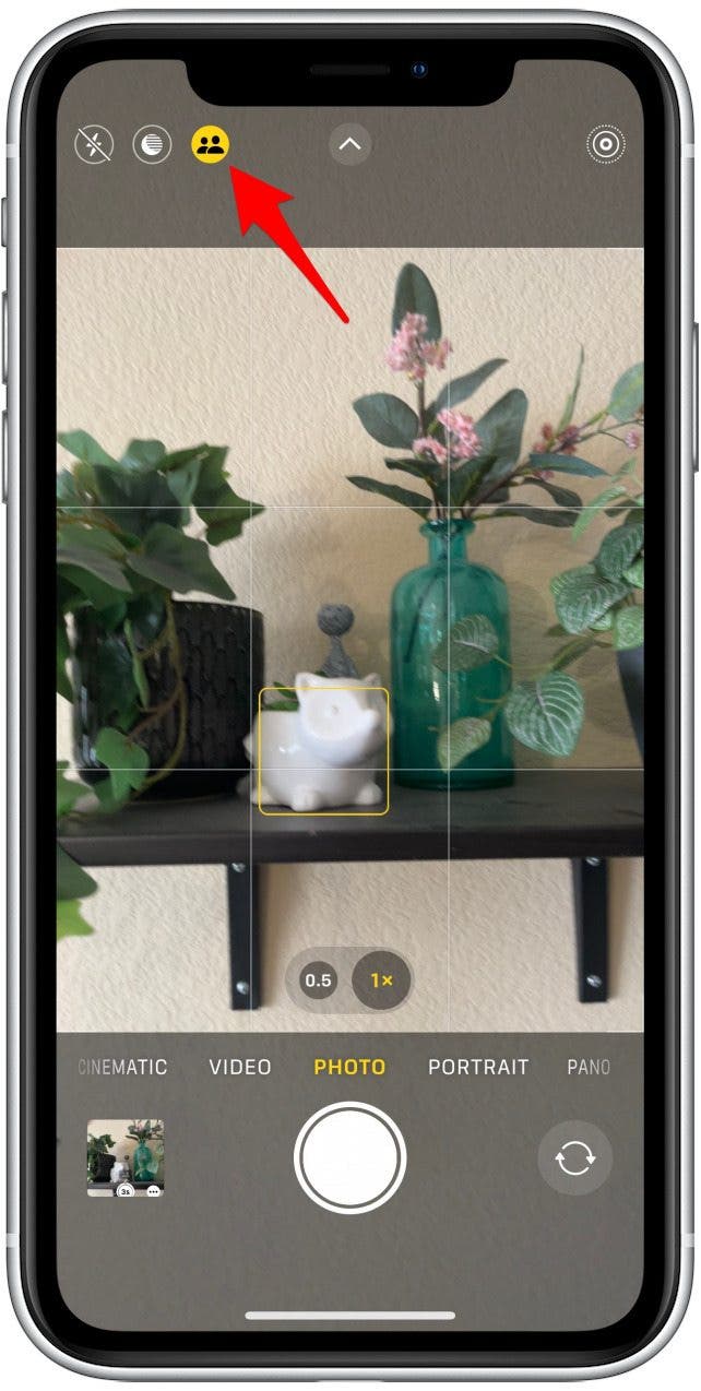 Open the Camera app, and you’ll see an icon next to the Night Mode and Flash icons in the upper left that looks like two people.