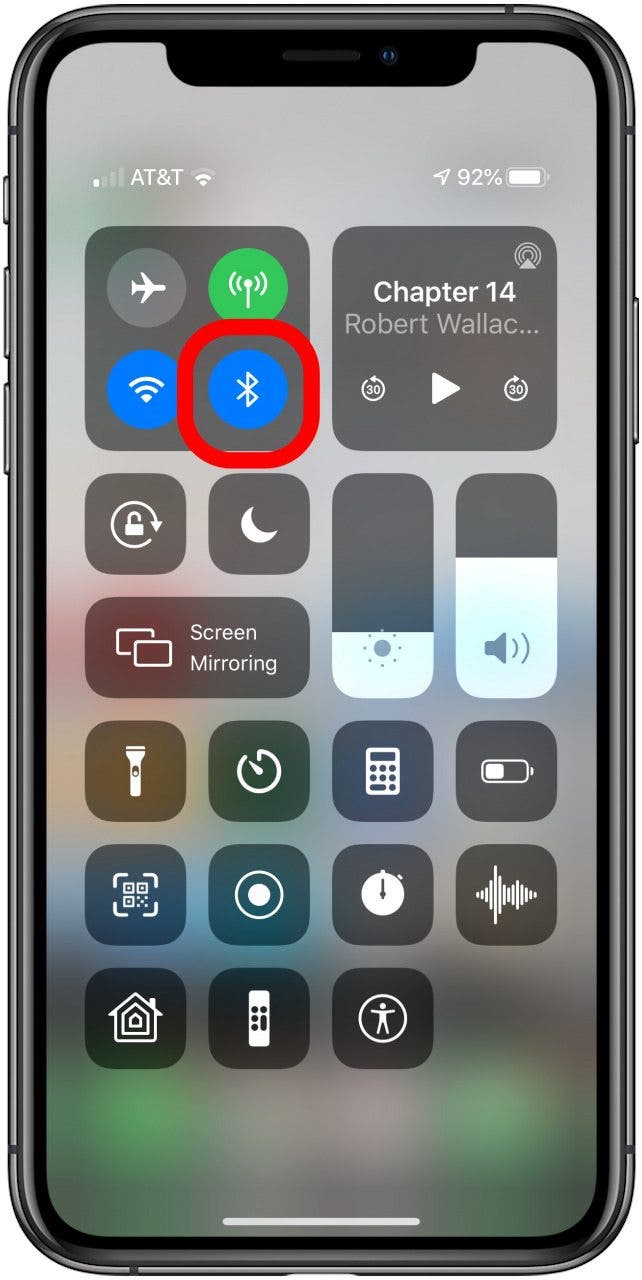 airpods keep cutting out: iPhone control center with bluetooth icon highlighted.