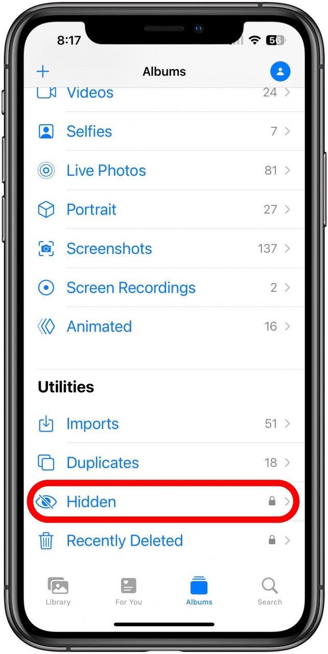 The Photos app on the Albums tab with the Hidden album marked.