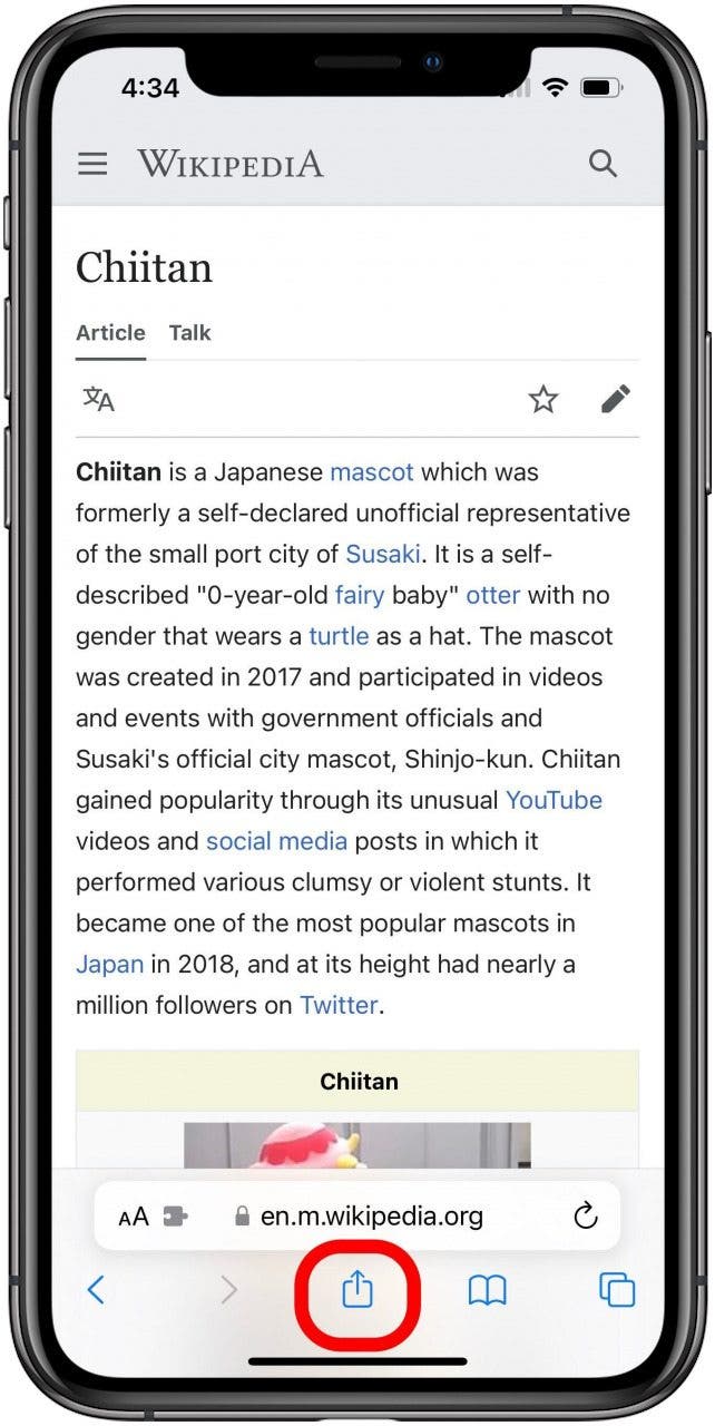 Safari with a Wikipedia article open and the Share button marked.