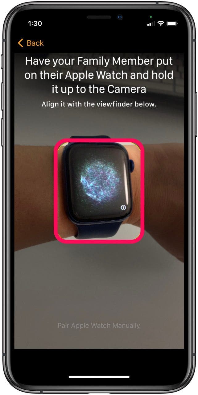 Have family member put on watch and line it up in the window on your iPhone screen to pair